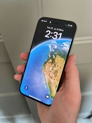 The Ultimate Guide to iPhone - What to Look for in an iPhone - hand holding an iPhone 14