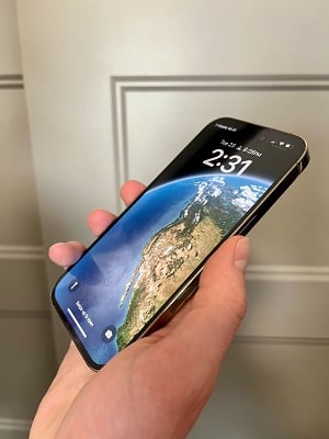 Ultimate guide to iPhones - hand holding an iPhone at an angle