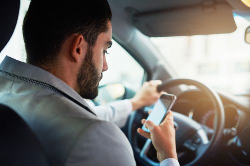 Cell Phone Driving Laws by State, Graded