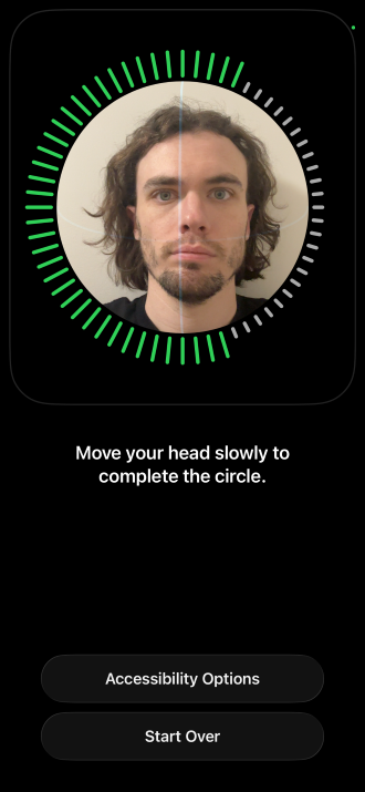 Setting up Face ID on an iPhone 14 Pro.