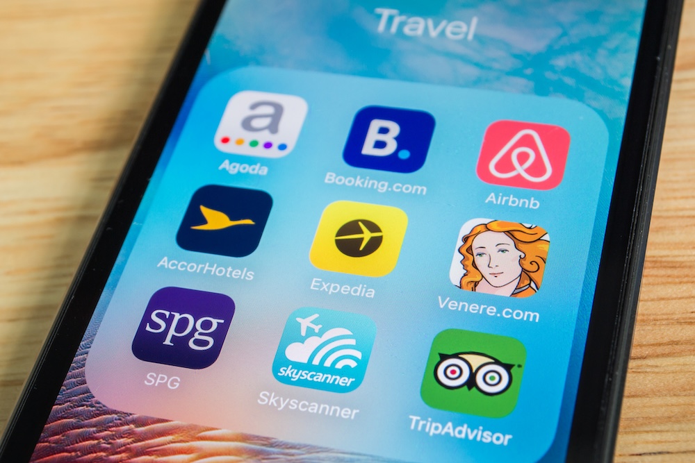 iPhone travel apps folder on screen