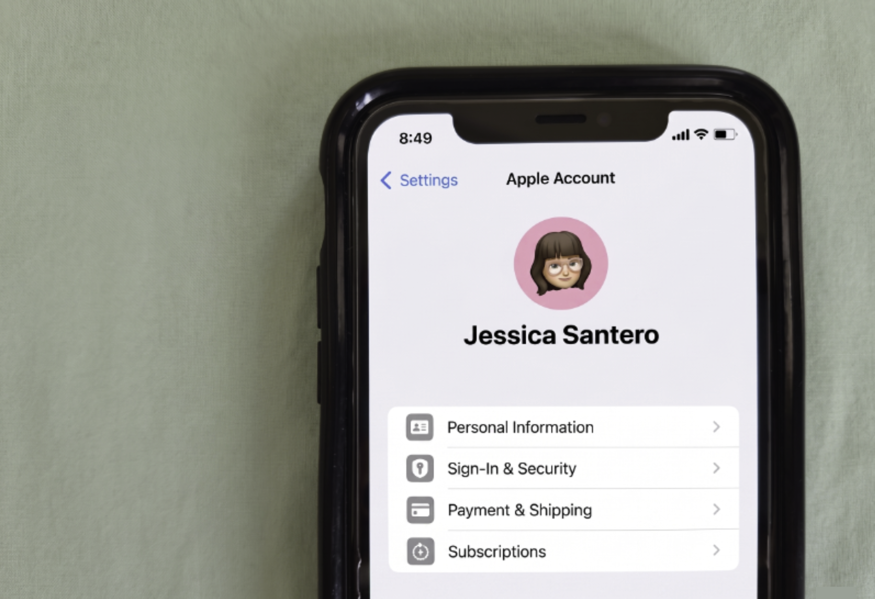 An image showing Jessica's Apple ID under settings on her iPhone 11.