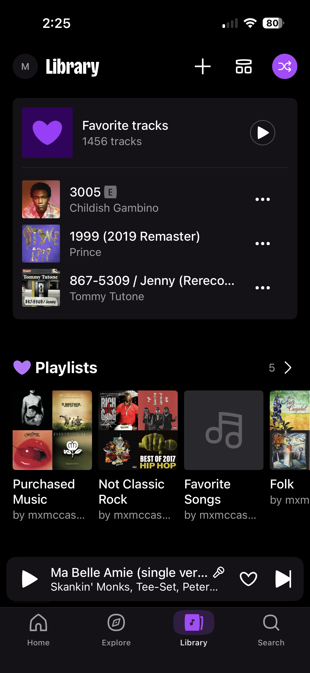 Screenshot of Deezer library showing saved songs and playlists.