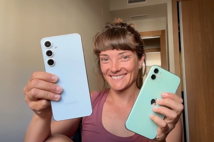 Jessica Santero holding her iPhone and Samsung Galaxy S24 FE side by side
