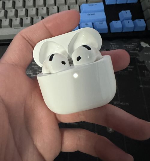AirPods 4 during the syncing process