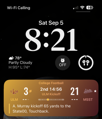 Apple Sports Live Activity showing a college football score on the iPhone Lock Screen