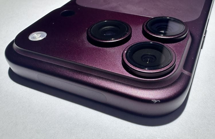 Scuff on the corner of a Burgundy iPhone 18 Pro's aluminum frame