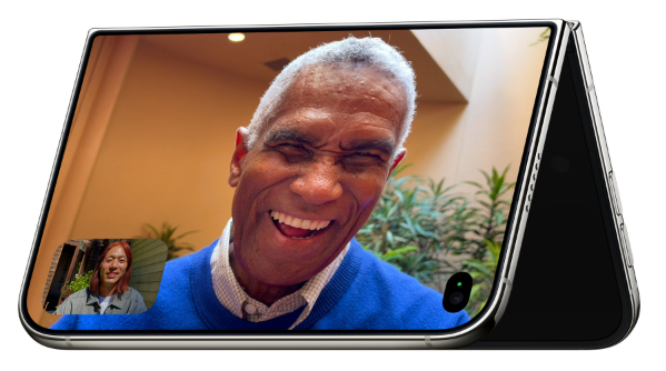 iPhone Duo partially folded showing a FaceTime call on the inner display with a smaller inset of the other caller.