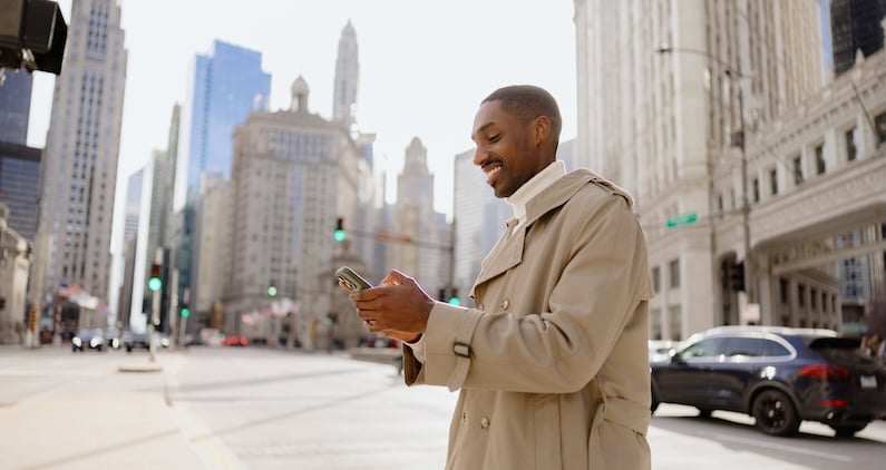Man walking with his phone in New York City.